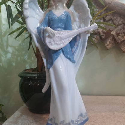 White and Blue Angel With The Musical Instrument