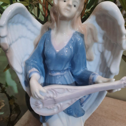 White and Blue Angel With The Musical Instrument