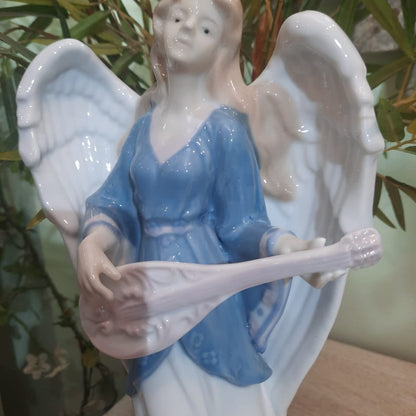 White and Blue Angel With The Musical Instrument